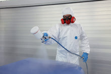 Load image into Gallery viewer, Man spray painting wearing Tyvek Suit IsoClean coveralls
