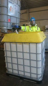 IBC Spill Saver being used by man in PPE