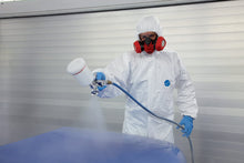 Load image into Gallery viewer, Man spray painting wearing Tyvek Suit IsoClean coveralls
